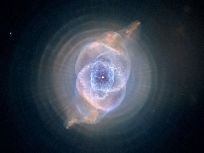 A picture of the Cat's Eye Nebula before 'gravitational lensing'